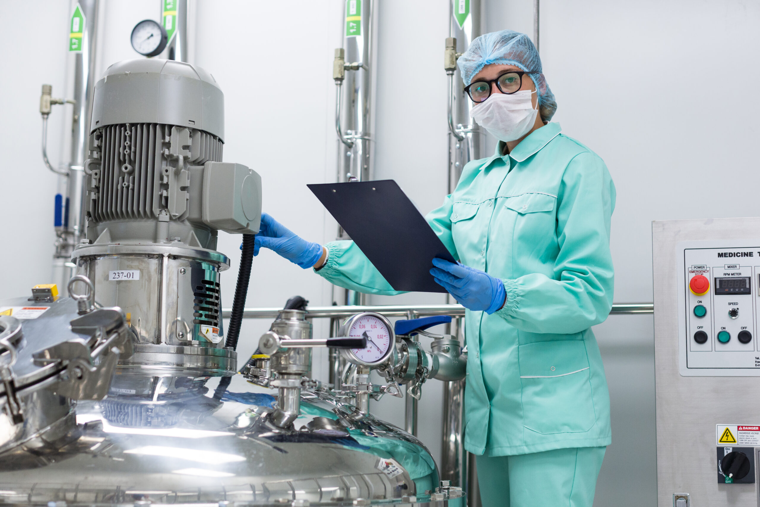plant picture, scientist standing near big steel tank with table